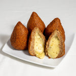Pack of 4 frozen Coxibe croquettes by Beth's, a fusion of Brazilian Kibe and Coxinha stuffed with a triple cheese blend.