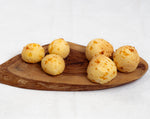 Pack of 100 cocktail size frozen Brazilian cheese bread or Pão de Queijo by Beth's, naturally gluten-free party snacks.